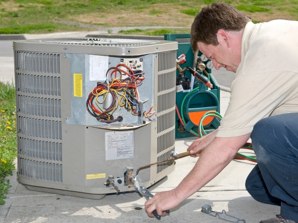 technician checking air conditioner