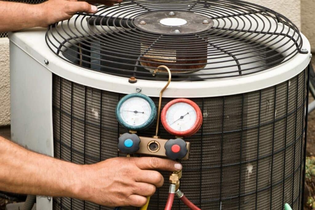 Professional HVAC technicians in Scottsdale with digital manifold gauges